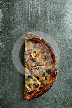 half a delicious homemade italian pizza on the table, pizza with wine, copy space for your text,