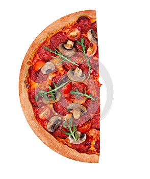 A half of delicious pizza hot with spicy salami, arugula, cherry tomatoes, mushrooms and texas spice mix, isolated on white