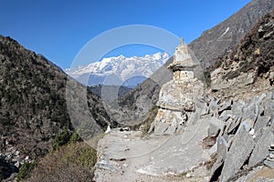 Half-destroyed buddhist stupa on the way to Everest base camp. photo