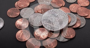 Half Dollar coin on top of quarter pennies and Dimes. USA Dollar coins