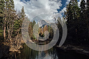 Half Dome with Mid Day Clouds and Reflection