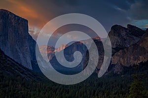 Half Dome rock climbing summits in beautiful golden light at sunset in summer, Yosemite National Park, California, USA