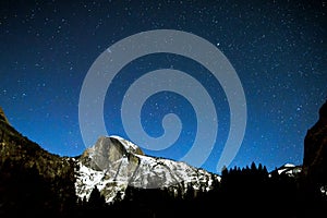 Half dome at Yosemite on a clear, starry, winter night