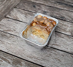 Half eaten brownie on wooden background