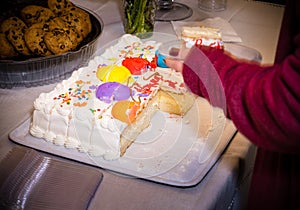 Half eaten cake with white frosting