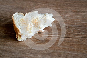 Half Eaten Sandwich thrown on the floor. Discarded Sandwich. Bread tossed to the floor. Thrown into the trash food. Concept