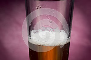 Half empty glass of beer