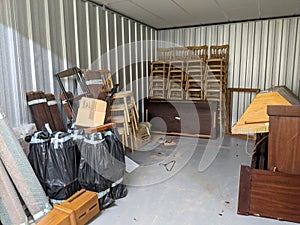 A half empty self storage unit clearance furniture removal