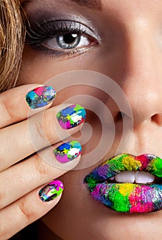 Girl with beautiful multicolor Minx nails and make-up