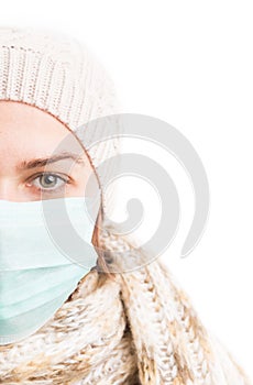 Half face of cold woman wearing medical mask