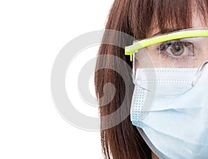 Half face of a dentist woman wearing protection glasses