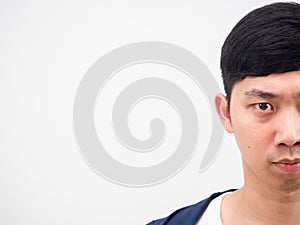 Half face of handsome man serious looking at camera on white isolated copy space