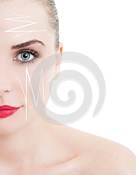 Half face portrait of beautiful woman with facelift arrows