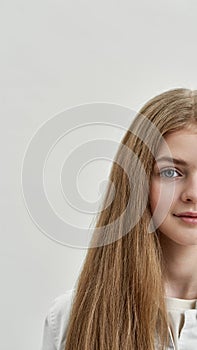 Half face portrait of smiling teen girl child