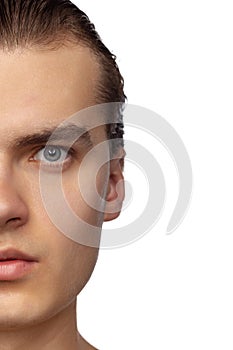 Half of face. Portrait of young handsome man isolated on white studio background. Concept of men's health, beauty