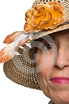 Half face senior woman with sun hat