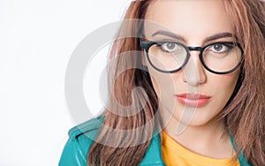 Half face shot of beautiful woman. Close up portrait of young woman. Head shot of cute girl, wearing green leather jacket,