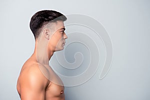 Half-faced profile side view portrait of confident shaven w