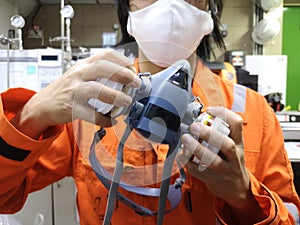 Half Facepiece Reusable Respirator, protect from vapor toxic from chemicals. Worker Prepare to wear a chemical mask