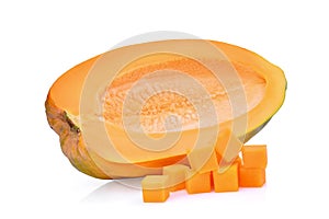 Half of fresh papaya seedless with cubes on white