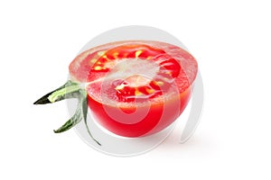 Half of fresh, red tomato with green leaves isolated on white background. Clipping path