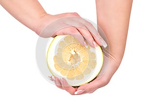 Half fruit oroblanco in hands