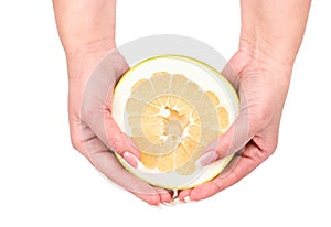 Half fruit oroblanco in hands