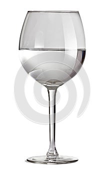 Half full glass for wine isolated on white background with clipping path. Glass with water.