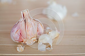 Half of garlic with one piece on wooden background, Halved garlic, Half of garlic Garlic close up, - shallow of dept