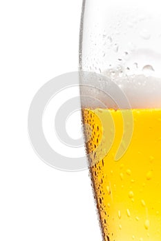 Half glass of fresh beer with drops