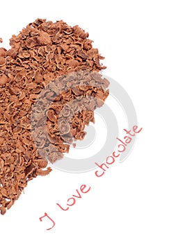 Half of heart from grated chocolate on white background
