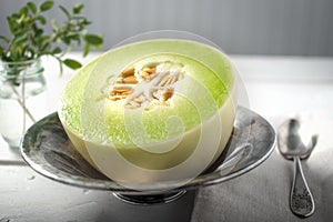Half of Honey Dew melon in a bowl