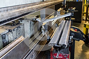 Half inch steel being bent in press