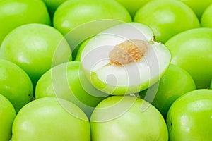 Half of a jujube green fruit, on pile isolated on white background. The file includes a clipping path easy to use. Close-up