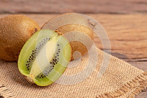 A half of kiwis slice placed on the brown sack