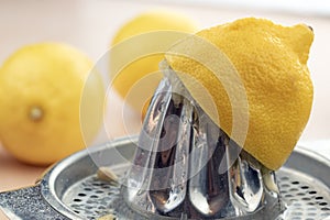 Half lemon on a hand juicer