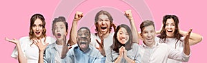 Half-length close up portrait of young people on pink background. photo