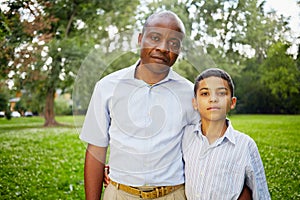 Half-length portrait of african father and son in