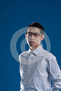 Half-length portrait, East Asian, blue background