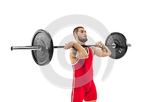 Half length portrait of man in red sportswear exercising with a weight isolated on white background. Sport