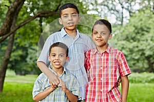 Half-length portrait of three boys-brothers who