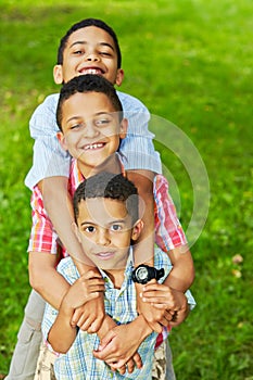 Half-length portrait of three boys-brothers who