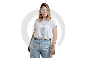 Half-length portrait of woman without make-up in casual clothes style looking at camera isolated on white background.