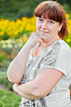 Half-length portrait of woman standing half-turned photo