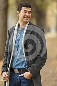 Half length portrait of young man in gray coat,