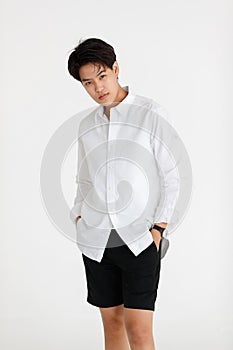 Half length shot portrait of a handsome good looking tomboy, a girl who loves to be a man, on white background