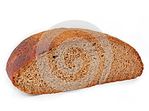 Half a loaf of dark rye bread close-up