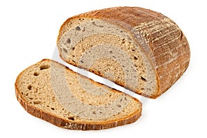 Half loaf of rye bread next to a slice of rye bread isolated on white