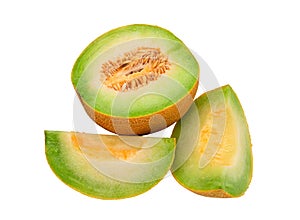 Half a melon and two slices on a white background