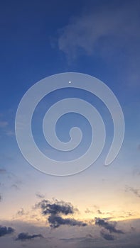 Half Moon above the sunset